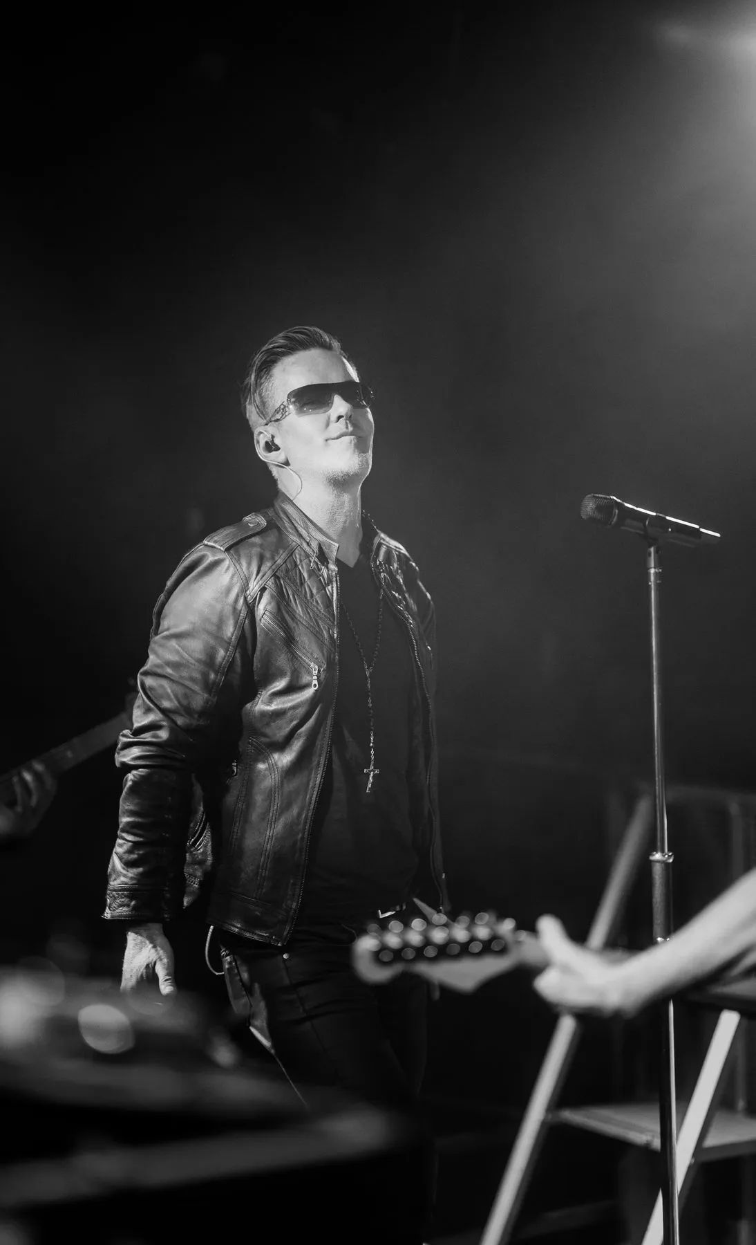 U2.V2 frontman performing under spotlights
